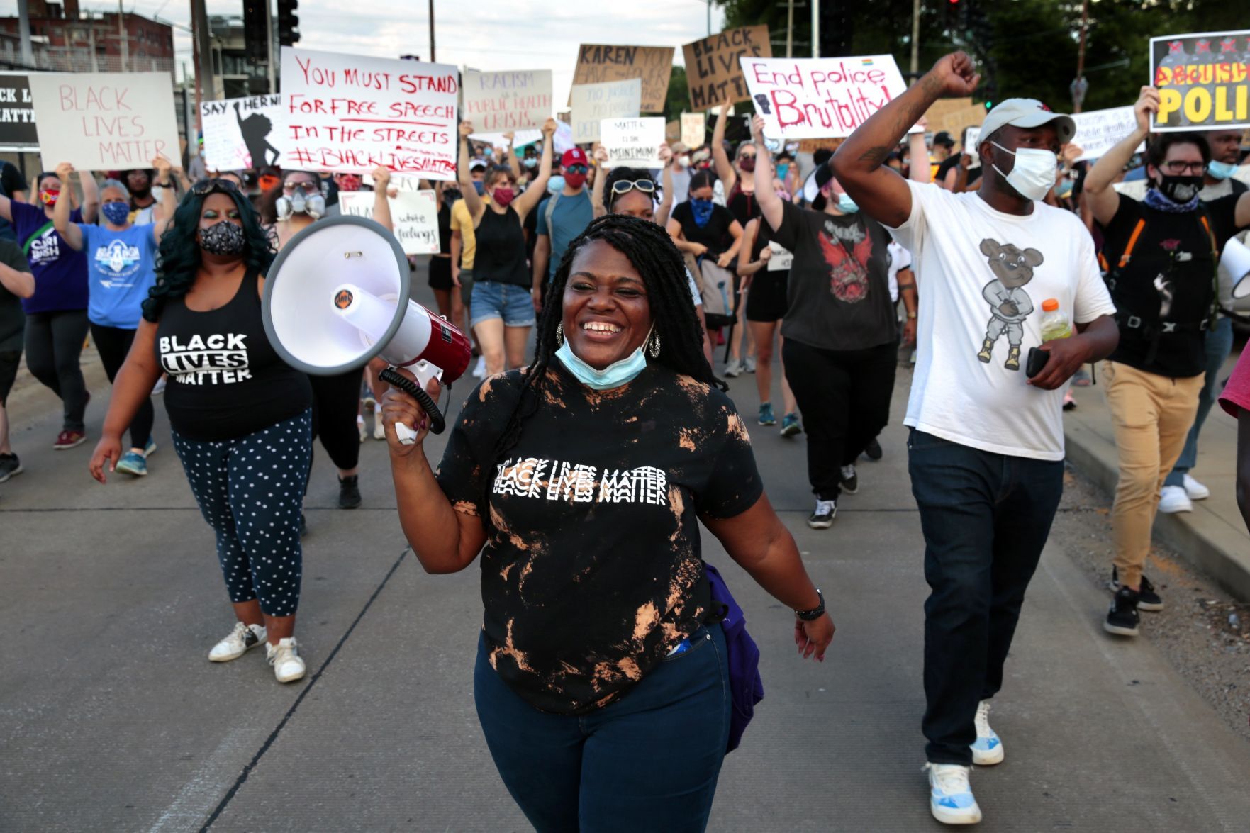 Protesters march through the Delmar Loop